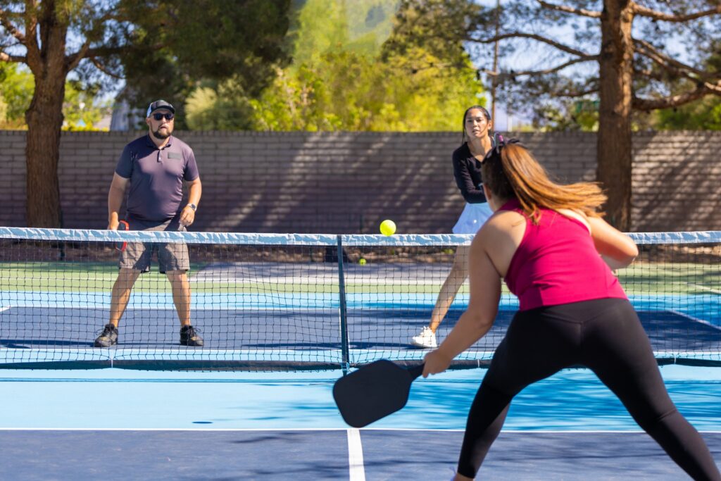 People playing a game of pickleball.