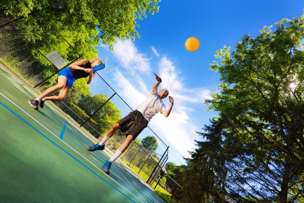 Two people enjoying a game of pickleball.